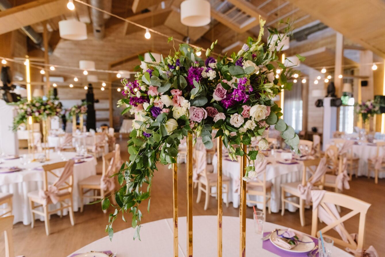 Volume magnificent composition from flowers at a wedding. Wedding floristics against the background of the hall